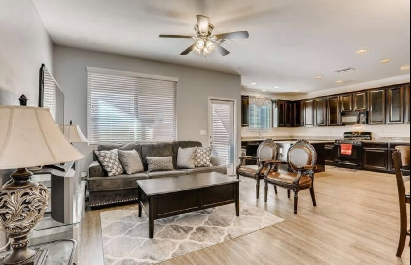Open-plan living room and kitchen inside one of the homes